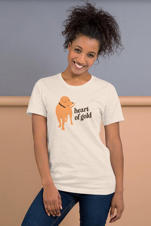White t-shirt with a golden retriever walking and looking to the side at the words 'Heart of Gold" written in dark brown
