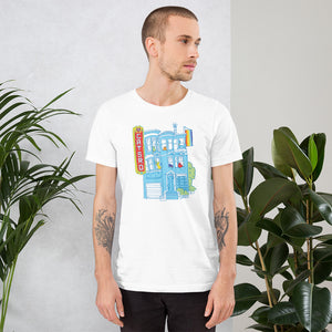 White T-Shirt with a classic Victorian San Francisco home in turquoise blue, a red Castro Theatre marquis on the left and a waving rainbow pride flag on the right.  In the windows of the building there's a variety of colorful cats