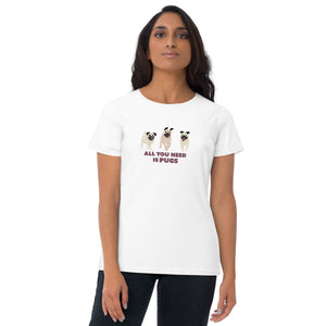 Girl in white t-shirt with 3 pug dogs on the front and the words “All you need is pugs” written underneath in black.